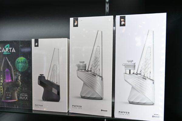 Puffco Peak, Peak Pro and Carta electronic dab rigs on a retail shelf