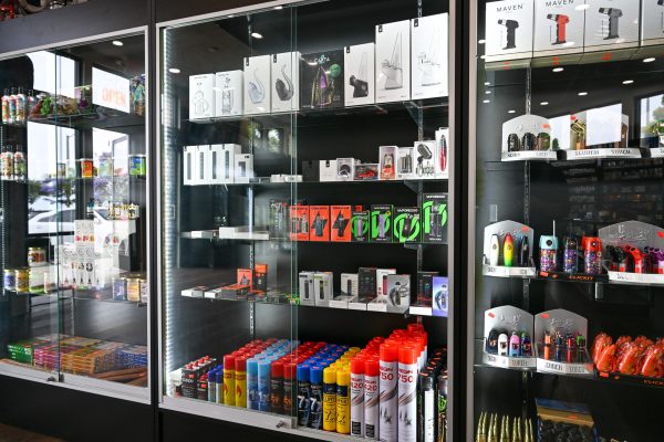 Display case of vape devices, torch lighters and butane refills